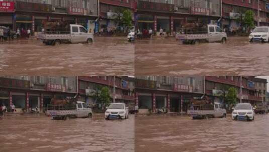 夏天四川水灾汽车行驶在被洪水淹没的街道高清在线视频素材下载