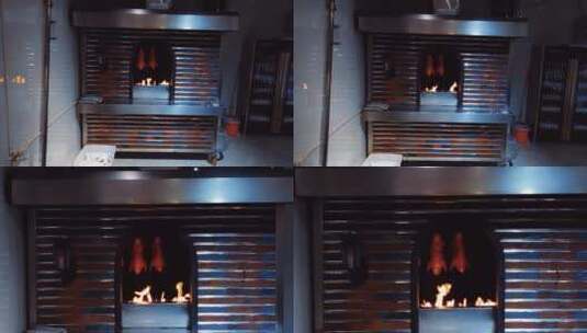 挂炉里被炉火烤制的烤鸭高清在线视频素材下载