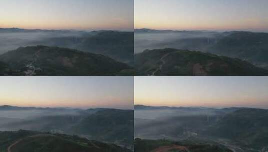 航拍清晨群山云雾缭绕可见高架桥高清在线视频素材下载