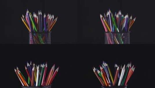 黑色背景下转动的彩色铅笔特写高清在线视频素材下载