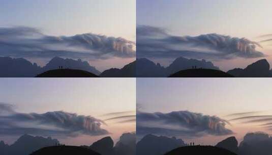 广西山脉山顶荚状云带人物航拍高清在线视频素材下载