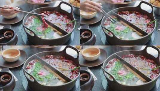 一桌鸳鸯锅火锅和火锅菜品高清在线视频素材下载