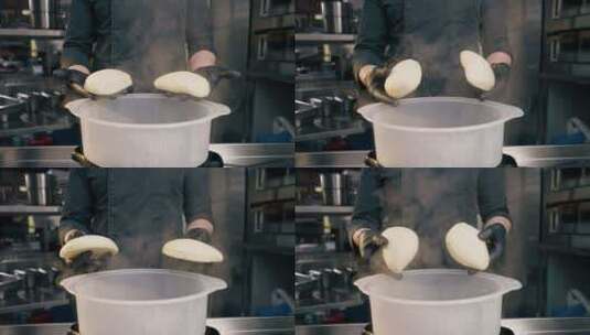 餐厅厨房的特写镜头厨师站在那里拿着面包放高清在线视频素材下载