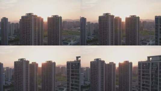 傍晚日落黄昏中的城市小区高楼建筑风景航拍高清在线视频素材下载