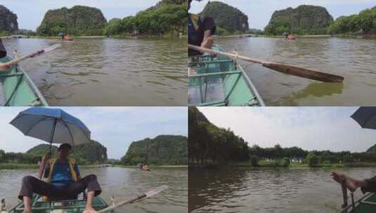 一个男人拿着雨伞坐在船上高清在线视频素材下载