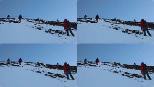 攀登四川岷山山脉雪宝顶雪山的登山队高清在线视频素材下载