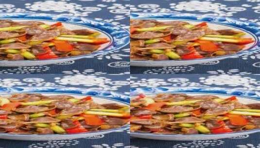 芹菜炒鸡杂美食菜品4k竖版滑轨平移高清在线视频素材下载