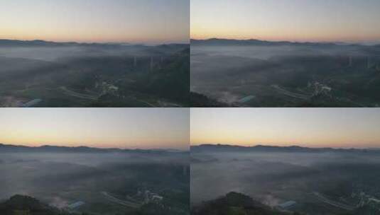 航拍清晨群山云雾缭绕可见高架桥高清在线视频素材下载