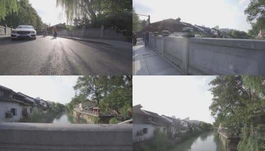城市街头马路垂柳江南水流蓝天白云河流高清在线视频素材下载