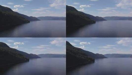阿尔泰蓝色晴朗天空山脉之间的Teletskoye湖上的船高清在线视频素材下载