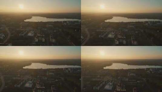 傍晚城市和湖泊背景下的日落高清在线视频素材下载