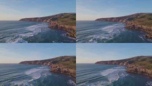 无人机航拍连绵起伏的海浪拍打海岸高清在线视频素材下载