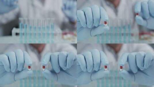 一位科学家在实验室拿着并展示几颗药丸的肖高清在线视频素材下载