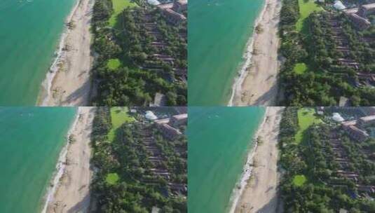 航拍三亚亚龙湾蓝天白云海浪游艇沙滩海岸线高清在线视频素材下载