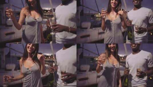 年轻的多种族夫妇手拿一杯香槟在划船派对上高清在线视频素材下载