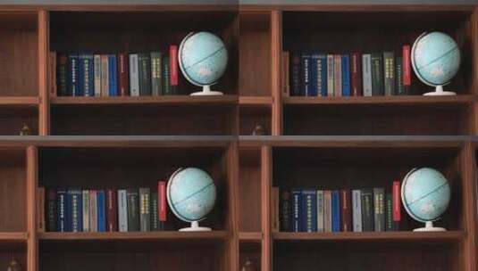 书架上陈列着整齐的一排书与一个地球仪高清在线视频素材下载