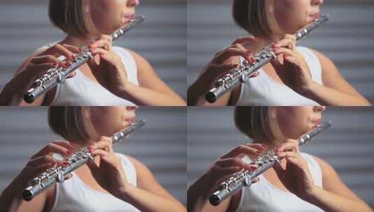 聚光灯下的职业音乐家女性长笛演奏。工作室高清在线视频素材下载
