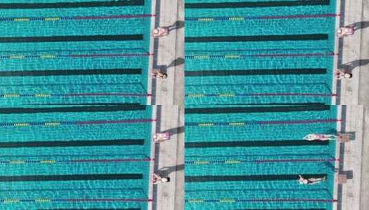 美女运动员跳入露天游泳馆水池训练专业航拍高清在线视频素材下载