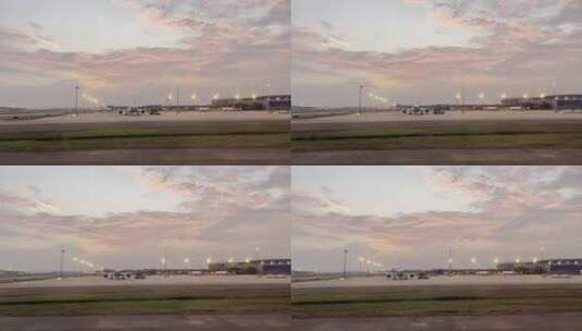 跑道上滑行飞机舷窗外傍晚机场风光高清在线视频素材下载