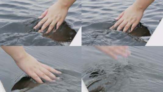 特写一个女孩在水中移动的手高清在线视频素材下载