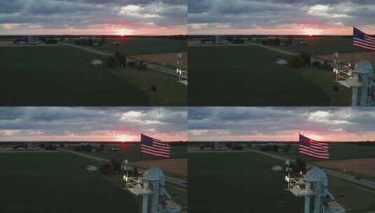 日落时分，密歇根农村的农场筒仓上挥舞着美国国旗，无人机视频移动着高清在线视频素材下载