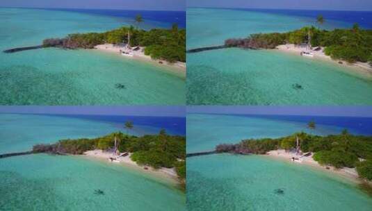 4K天堂阳光明媚的白色沙滩和蓝色大海背景的日间空中岛屿景观高清在线视频素材下载