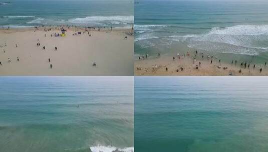 三亚市三亚湾大东海旅游区沙滩上的游客高清在线视频素材下载