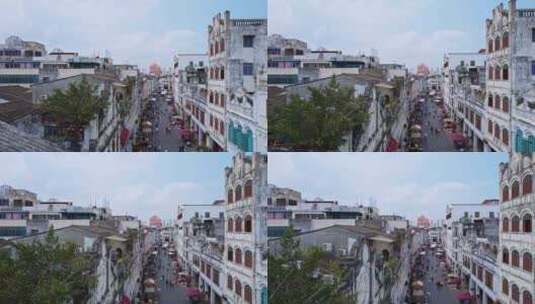 中国海南海口骑楼老街上的游客高视角航拍高清在线视频素材下载