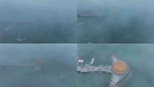 航拍云海下的青岛地标栈桥高清在线视频素材下载