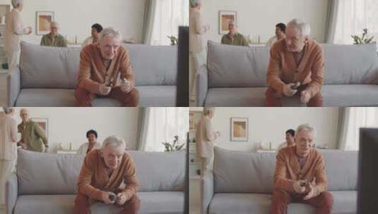 老人看电视情绪激动高清在线视频素材下载