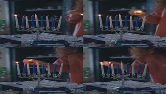 女人点燃蜡烛的竖屏拍摄镜头高清在线视频素材下载