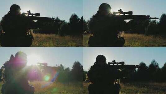 阳光下拿着枪前进猎人的剪影高清在线视频素材下载