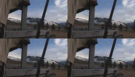 摄像机透过有盖货车的开口观看远处的山脉高清在线视频素材下载
