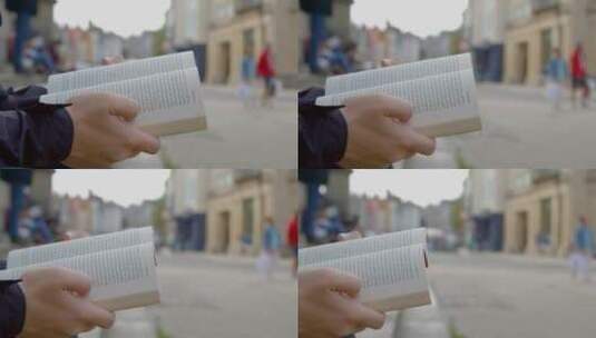 拍摄男人捧着一本书的平移镜头高清在线视频素材下载