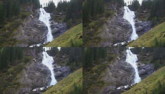 森林里岩石间的瀑布高清在线视频素材下载