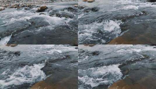 慢镜头，河流奔涌遇到石块溅起白色浪花高清在线视频素材下载