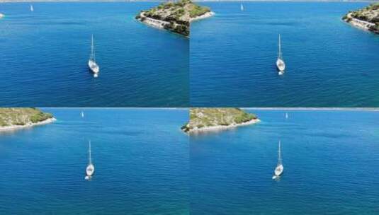 希腊埃里索斯阿吉亚索菲亚海滩附近的豪华游艇航行。天线高清在线视频素材下载