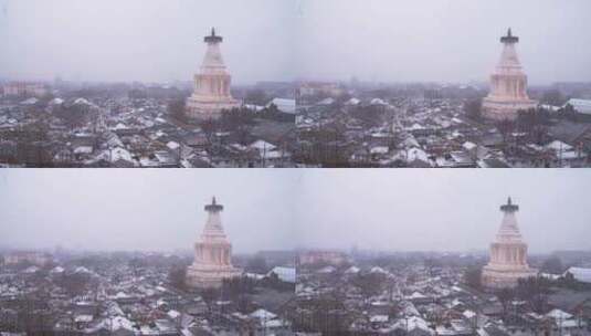 下雪中的北京白塔寺高清在线视频素材下载