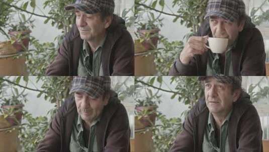 孤独无家可归体贴老人在寒冷的天气里喝咖啡高清在线视频素材下载