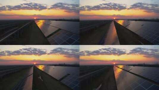 夕阳中的太阳能光伏板航拍高清在线视频素材下载