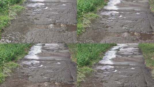 下雨雨滴落在道路上高清在线视频素材下载