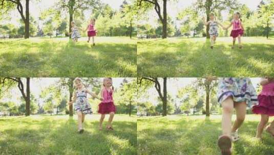 两个小女孩手拉手在草地上奔跑高清在线视频素材下载