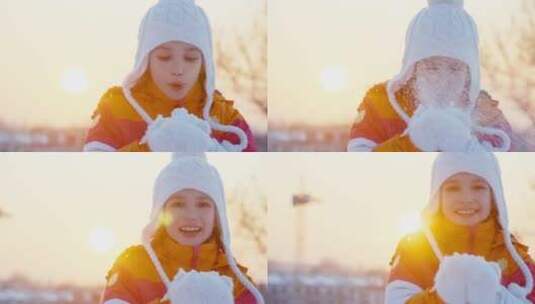 日落时分女孩吹手上的雪花高清在线视频素材下载