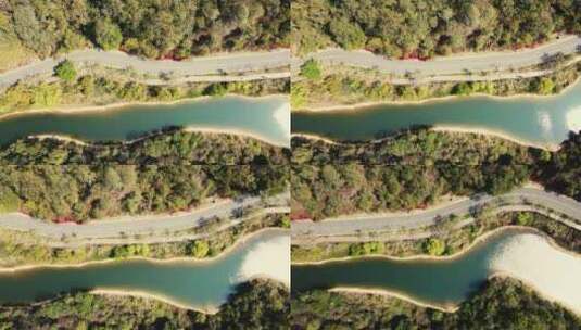 4K俯拍沿江公路高清在线视频素材下载