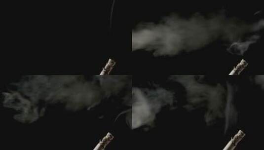 黑色背景上的烟蒂和喷烟高清在线视频素材下载
