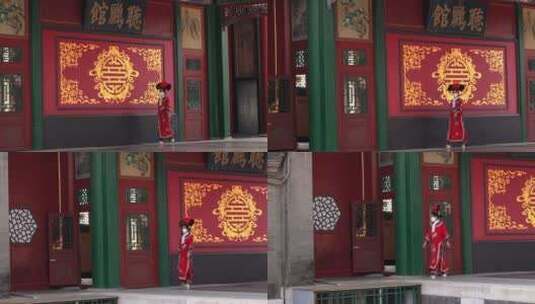 穿宫廷服饰旗袍走过颐和园听鹂馆戏台的女性高清在线视频素材下载