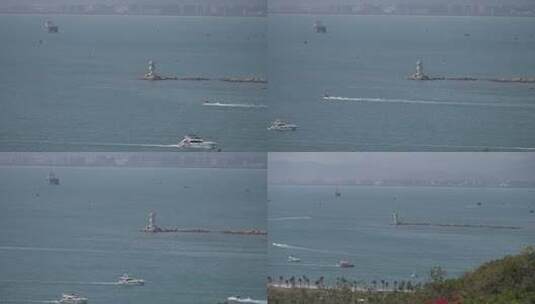 三亚海中灯塔行驶的渔船邮轮高清在线视频素材下载