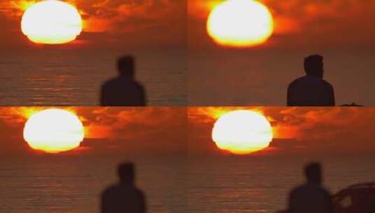 一个男人在海滩上看日落高清在线视频素材下载