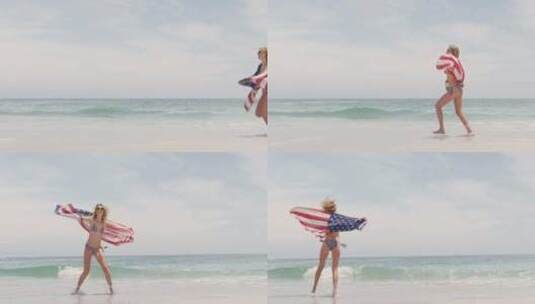 女人挥舞着国旗在海滩上奔跑高清在线视频素材下载