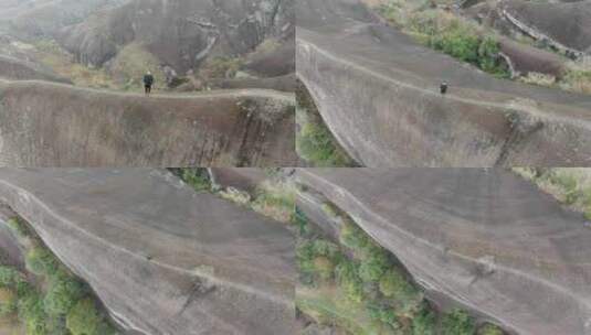 高椅岭刀背山顶无人机航拍男人站在山脊悬崖高清在线视频素材下载